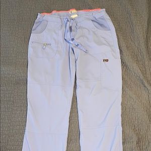 Three pairs Koi Lite Ceil Blue scrub pants